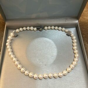 Cultured freshwater pearl strand with a sterling silver clasp